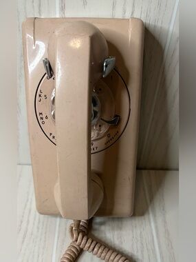Vintage rose color rotary wall phone 70’s